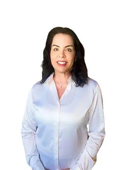 Smiling woman in a shiny shirt, physical therapist Stacy Brown from Arlington Physical Therapy, ready to assist patients.